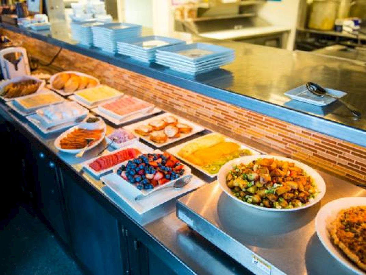 A buffet at Hotel Columbia Telluride with various dishes and desserts displayed.